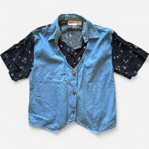 Vintage blue denim vest with black floral print short sleeve top combination